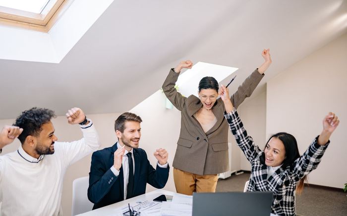 A group of colleagues celebrating together