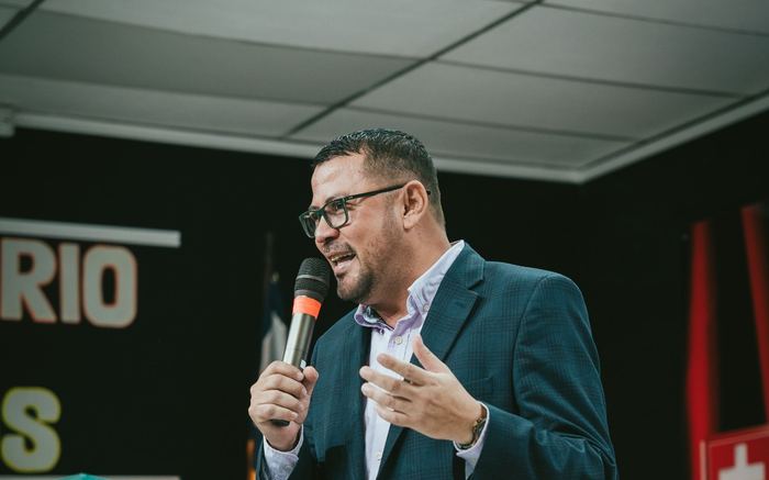 A representative speaking into a microphone at a podium