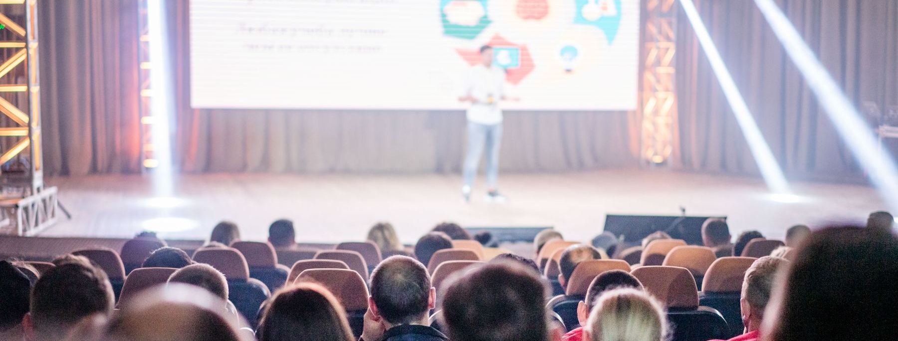 Audience watching a presentation at an AVL industry event