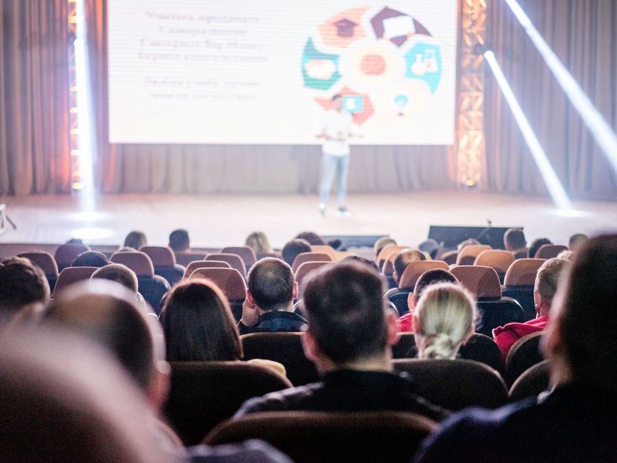 Audience watching a presentation at a conference